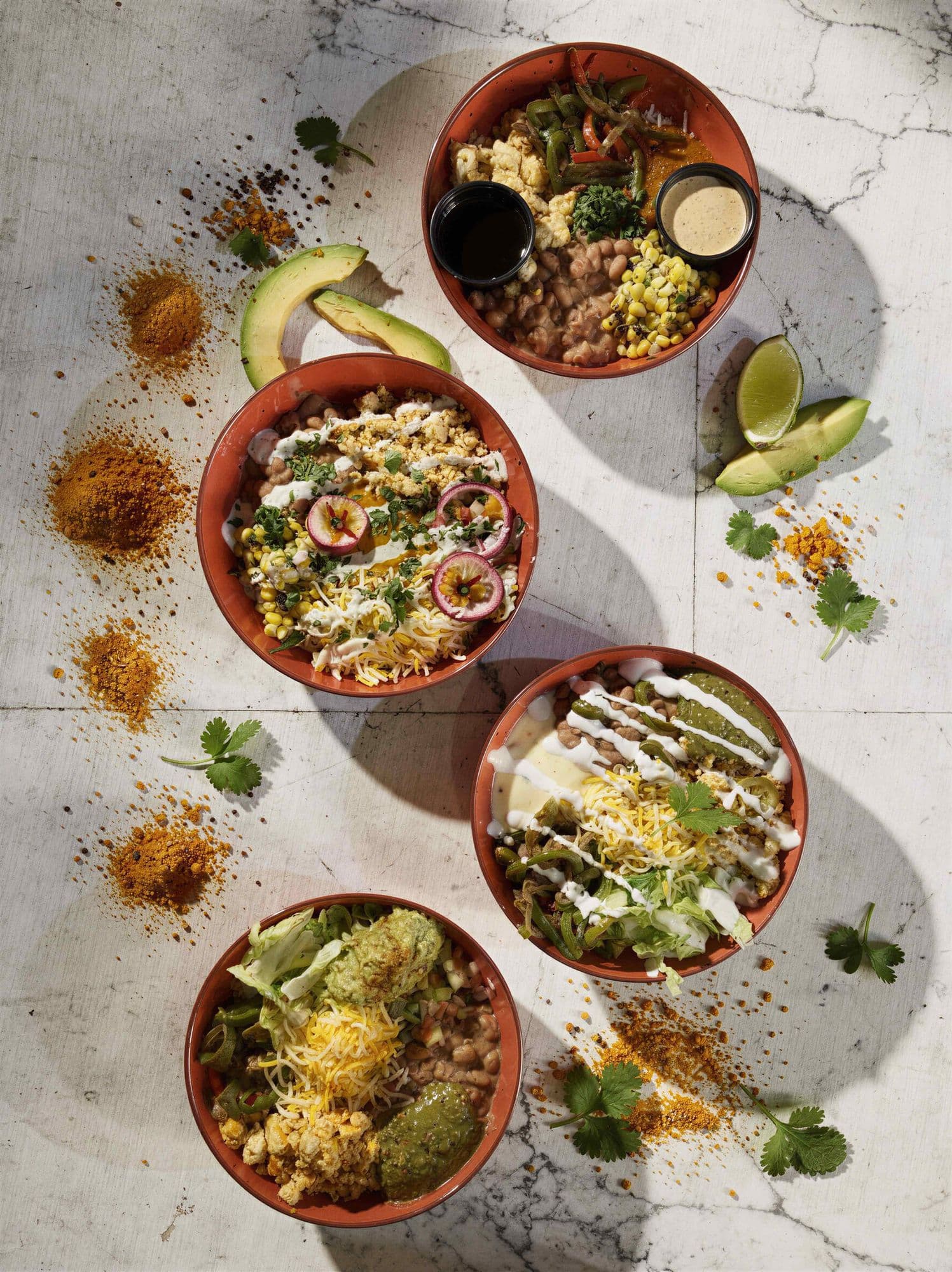 Four colorful Indo-Mex fusion bowls